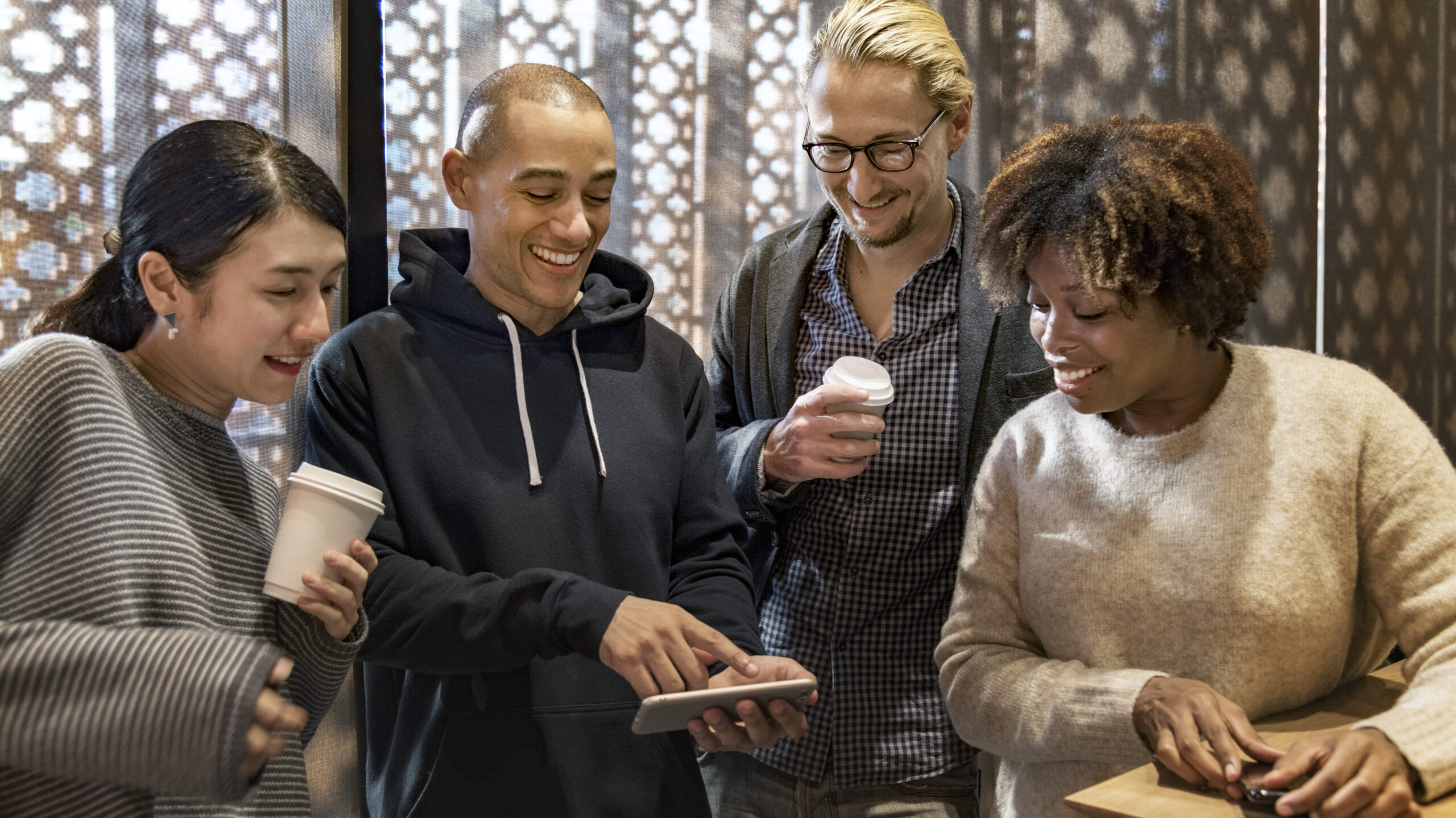 Friends looking at a smartphone